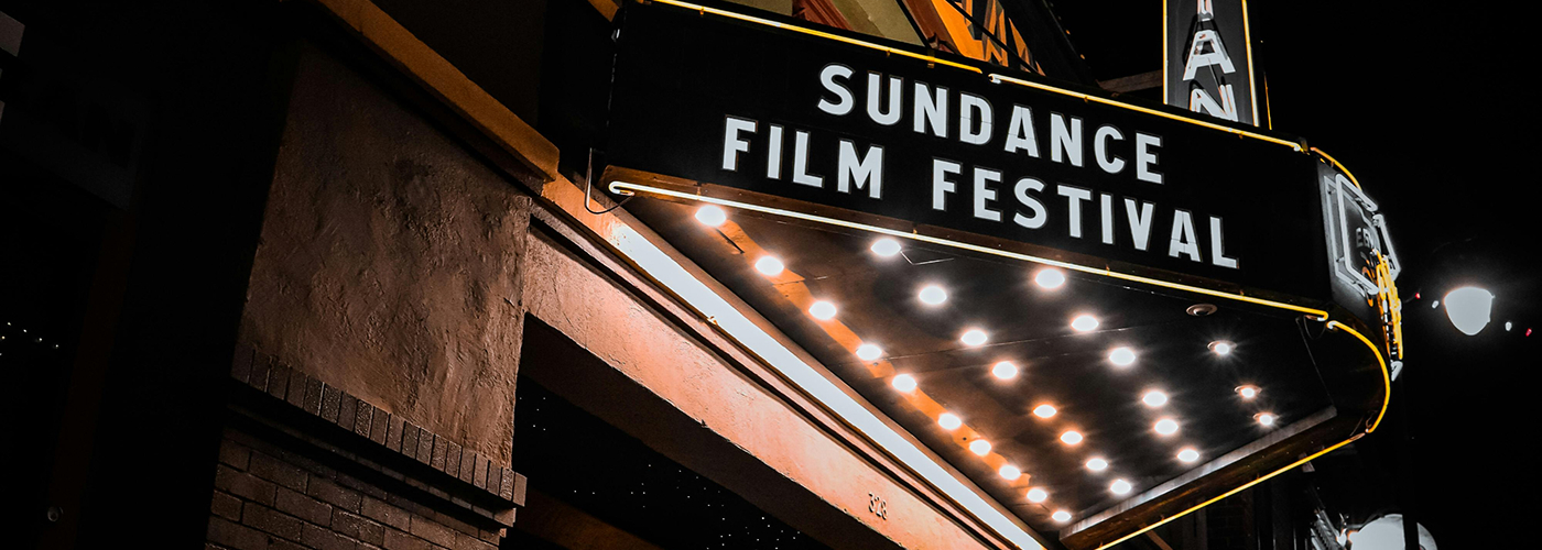 Theater marquee sign at night with festival name